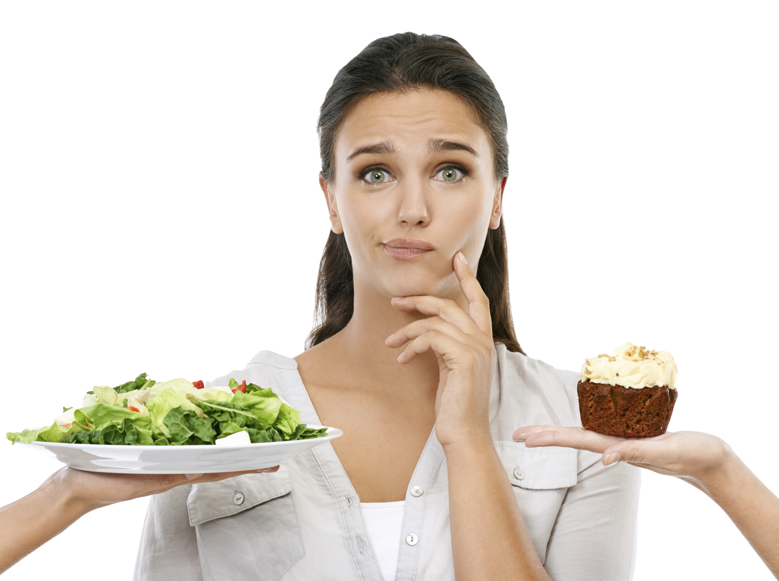 Studio shot of a young woman choosing between a healthy and unhealthy diet
